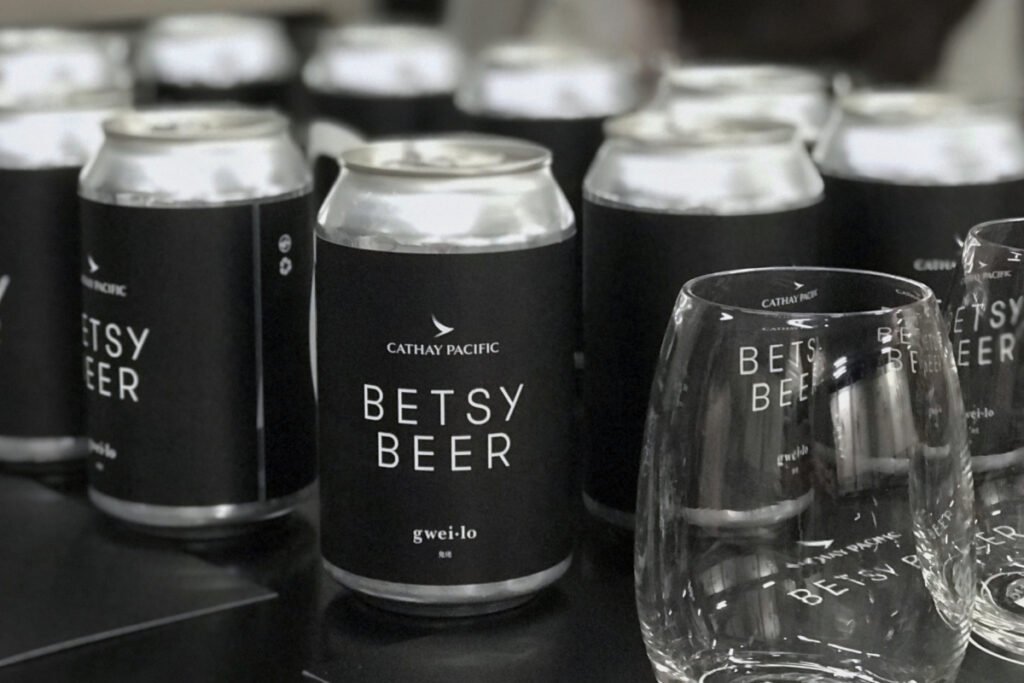 Betsy Beer High-Altitude Sensory Analysis Kenneth Ho performing sensory evaluation of Betsy Beer at 38,000 feet for Cathay Pacific and Gweilo Beer.